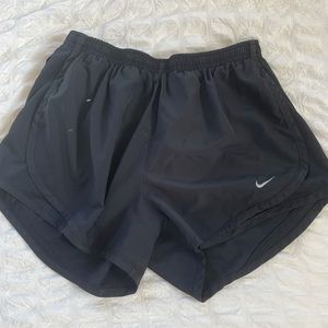 All black Nike shorts, size small